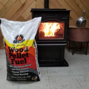 Red wood pellet bag next to a stove