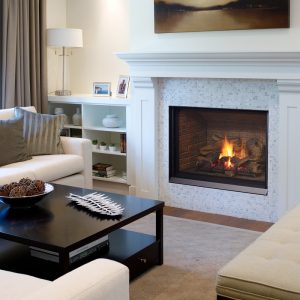 White fireplace insert in a living room with white walls and furniter