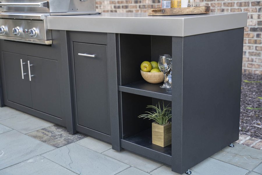 close up of the drawers in a black outdoor kitchen