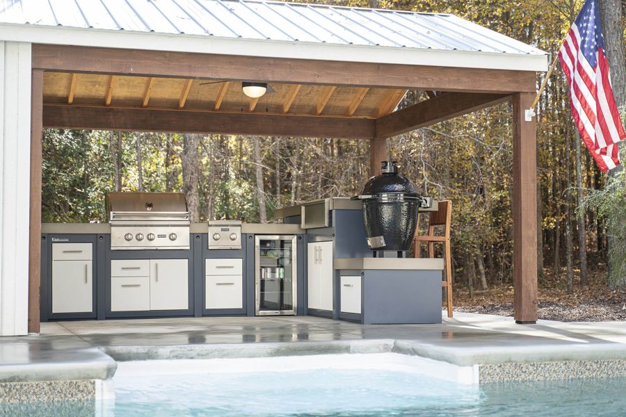 Outdoor kitchen next to a pool