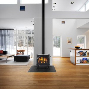 Black woodstove in a large living room with modern decorations