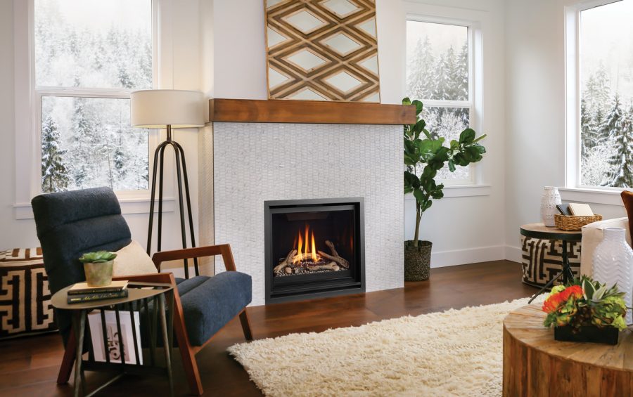 Gas fireplace insert in a white room with three windows and some furniture and fancy decorations