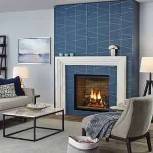 Fireplace insert with white frame and blue tiles in a modern home with furniture