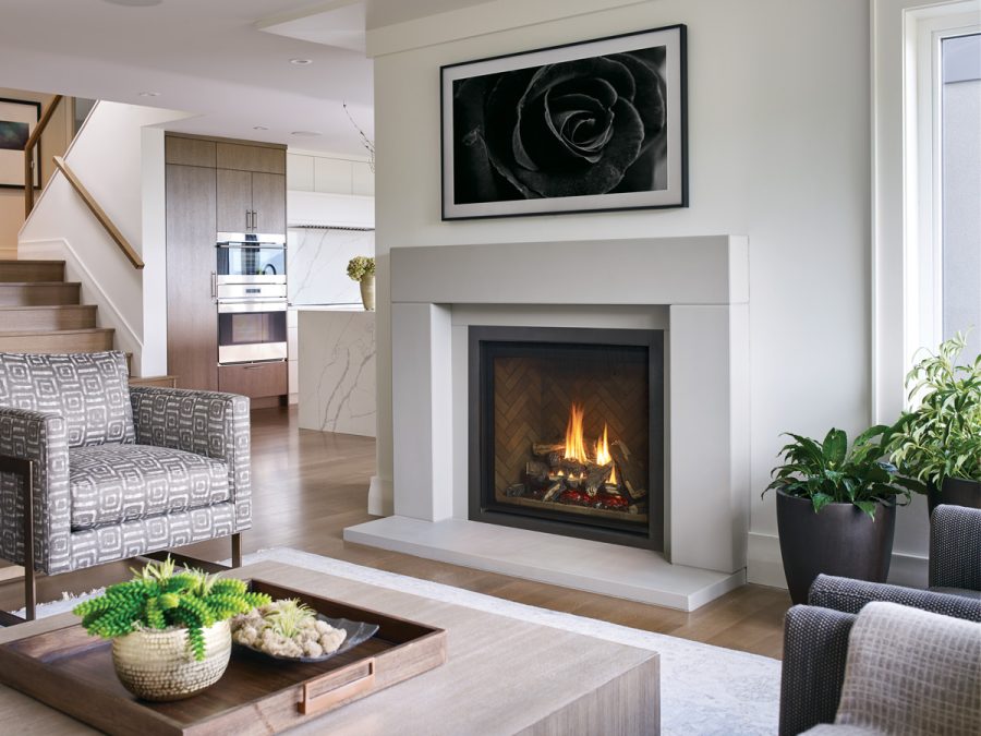 White fireplace insert in a room with stairs and white comfortable furniture