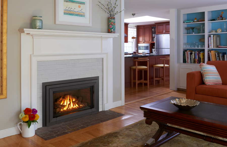 Gas Fireplace insert in a dining room with a kitchen in the morning