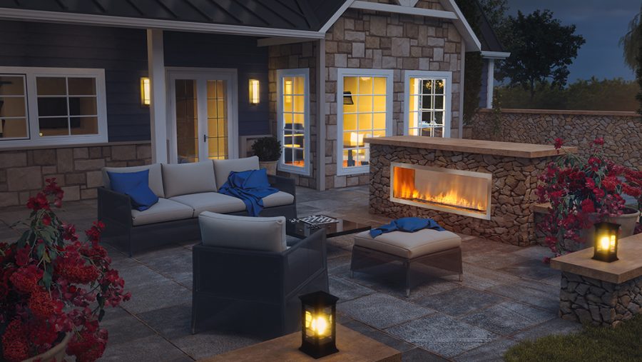 Outdoor fireplace insert built in a seating area behind a house