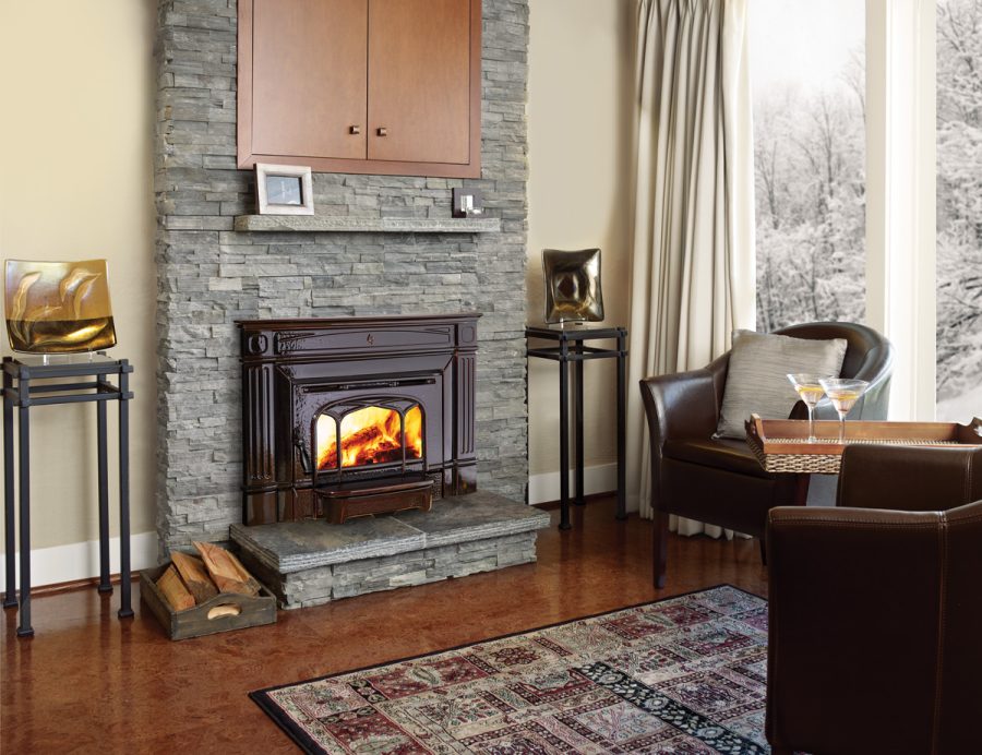 Stone wood fireplace insert in a cozy living room with nice seating