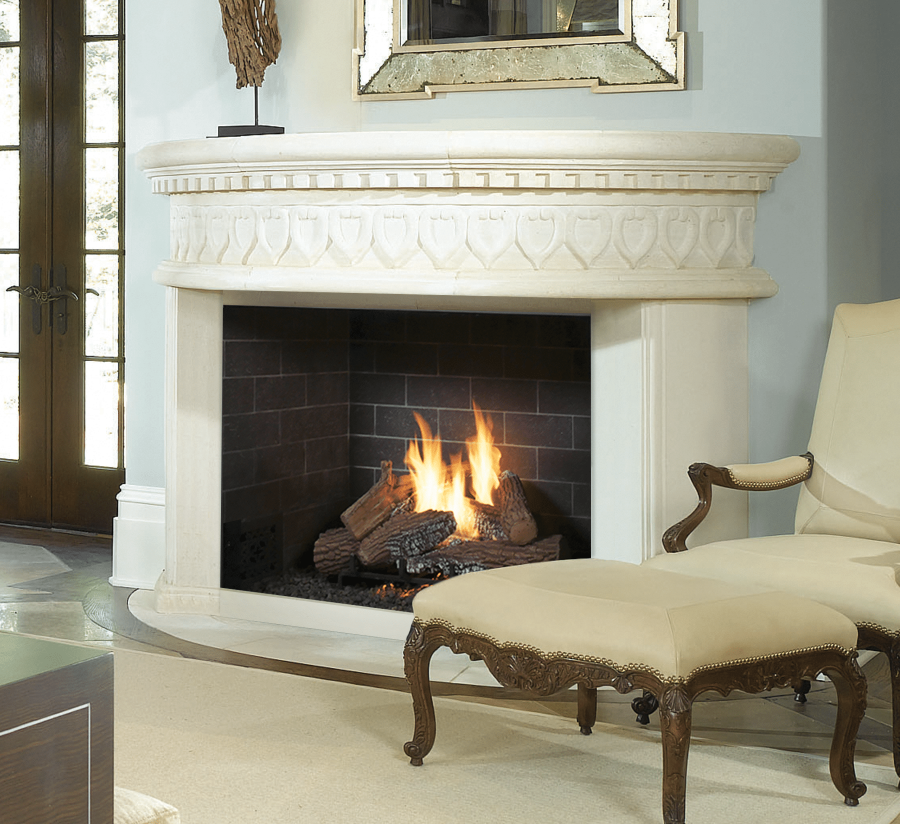 White fireplace with a white seat next to it