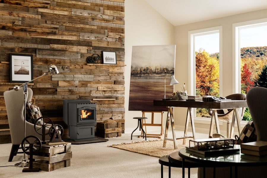 Pellet stove in a brightly lit room with a painting and some furniture