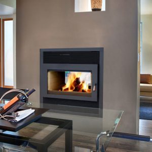 two sided fireplace in the middle of the modern home with a fire going