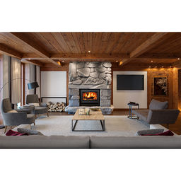 Wood fireplace in a office like living room with a wood ceiling