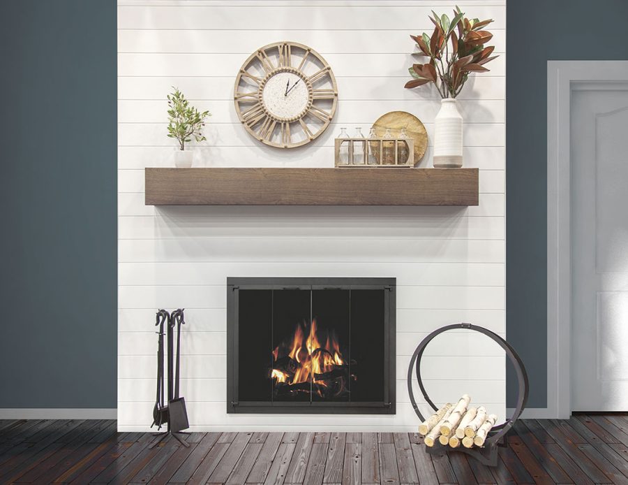 White aluminum surround on a fireplace with green walls behind it