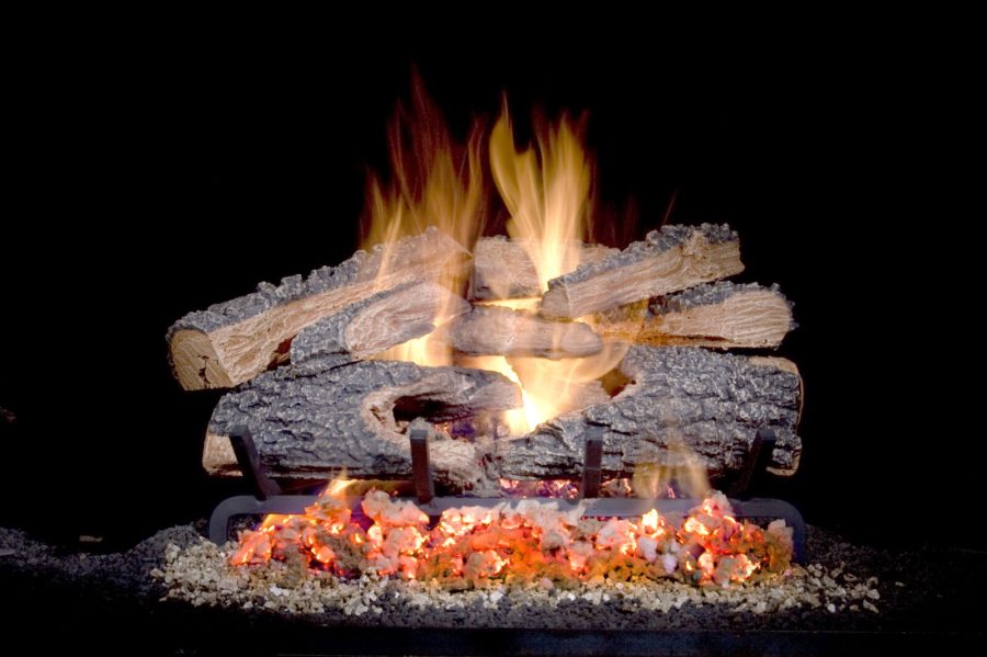 Gas vented log set with embers and a flame going