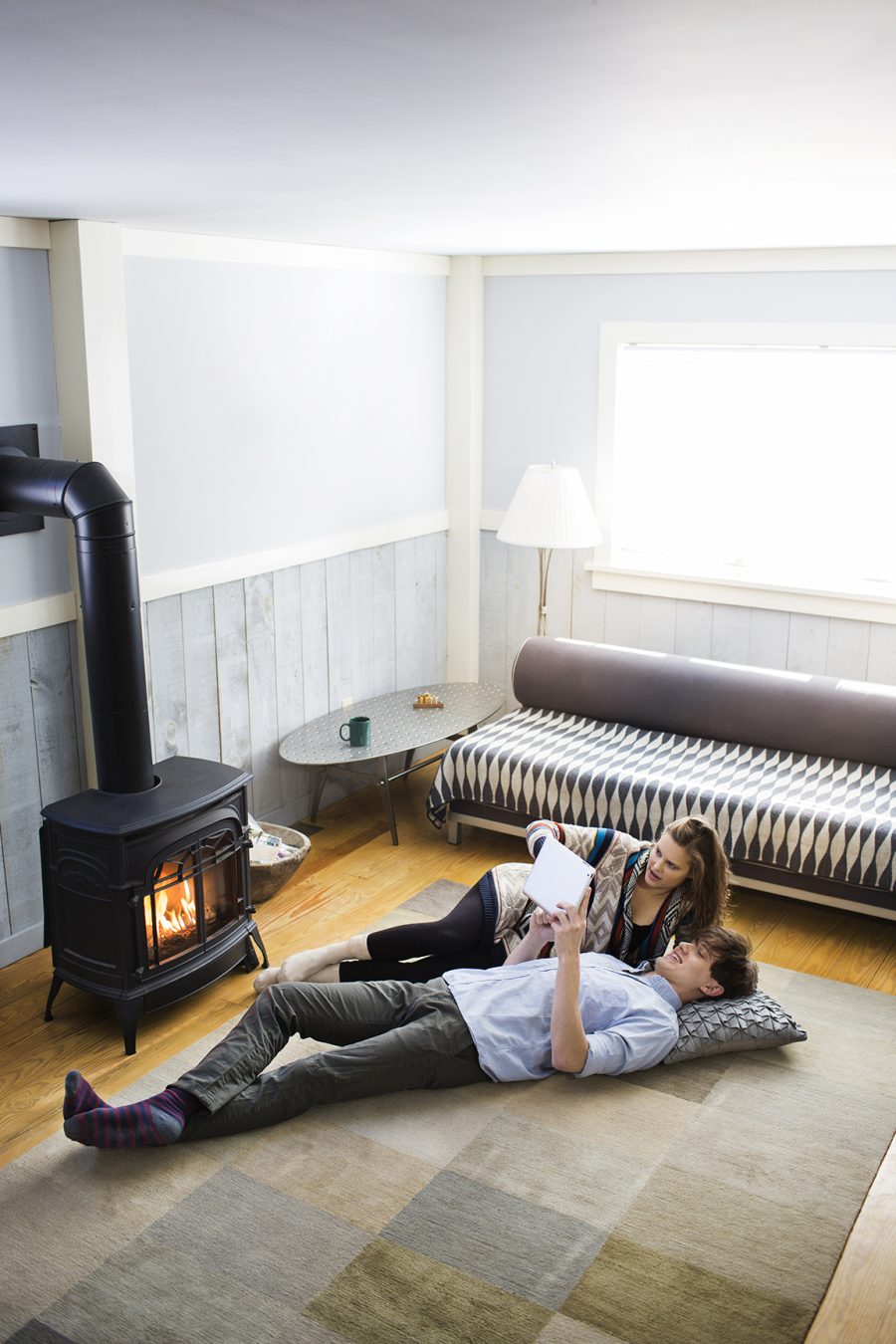 Gas stove in a living room with a small family