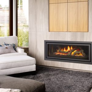 Contemporary gas fireplace insert in a modern living room with white furniture and cement walls