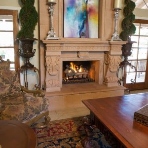 Fancy fireplace in a dining room with a fire going