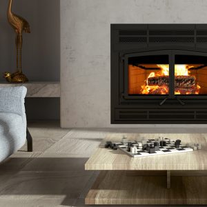 Wood fireplace in a modern home with some comfortable seating and a fire going