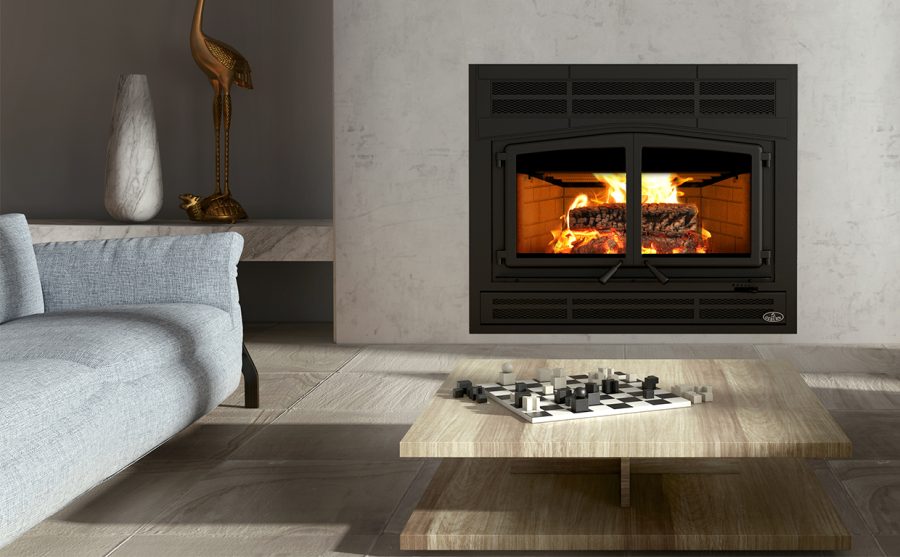 Wood fireplace in a modern home with some comfortable seating and a fire going