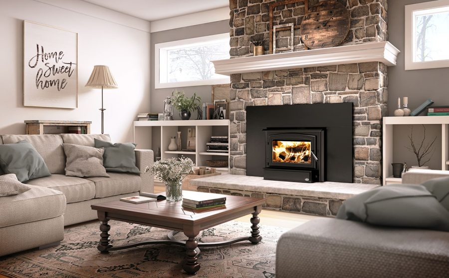 Wood fireplac einsert with warm fire going with some furniture and two windows.