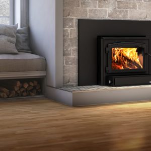 Wood fireplace insert in a plane room with wood floors