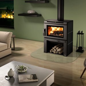 Futuristic looking wood stove with a green wall behind it and some furniture