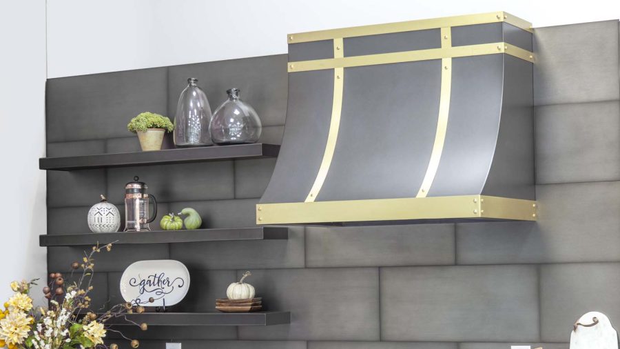 Brass range hood with gold lining